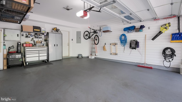 274 W Ashland St, Doylestown, PA 18901 - garage featuring electric panel, a garage door opener, and a workshop area