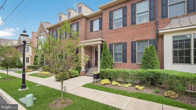 274 W Ashland St, Doylestown, PA 18901 - view of front of property with brick siding, a residential view, and a front lawn