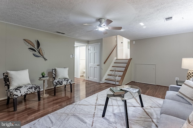 4717 Eddystone St, Annandale, VA 22003 - living room with wood finished floors, stairway, ceiling fan, and a textured ceiling