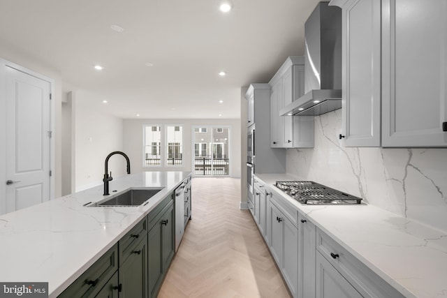23079 Copper Tree Ter, Ashburn, VA 20148 - kitchen featuring wall chimney range hood, stainless steel appliances, recessed lighting, decorative backsplash, and light stone countertops