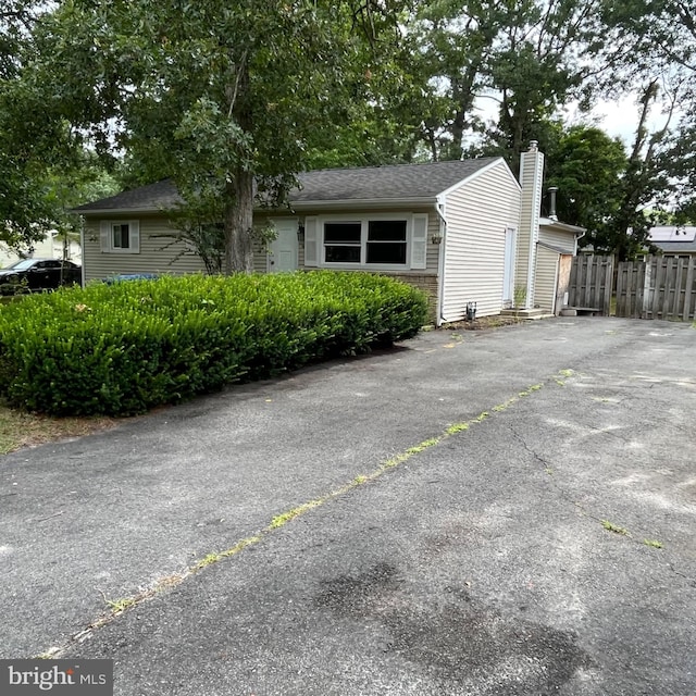 14 Akwaala Trl, Browns Mills, NJ 08015 - view of side of property with a chimney and asphalt driveway