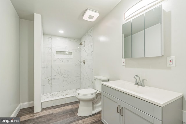 511 Sylvan Way, Pasadena, MD 21122 - bathroom featuring vanity, wood finished floors, a marble finish shower, and recessed lighting