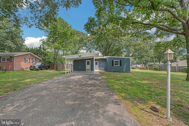 511 Sylvan Way, Pasadena, MD 21122 - mid-century home with asphalt driveway and a carport