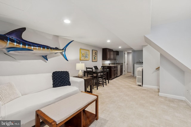 425 16th St SE, Washington, DC 20003 - living room featuring bar with sink, recessed lighting, light colored carpet, and radiator heating unit