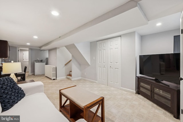 425 16th St SE, Washington, DC 20003 - living area with light carpet, recessed lighting, washer / clothes dryer, radiator heating unit, and stairs