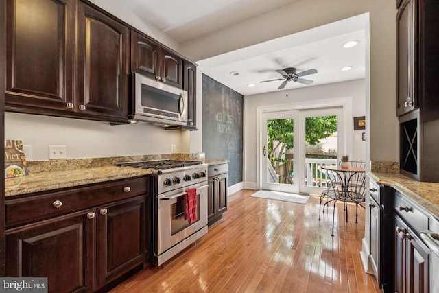 425 16th St SE, Washington, DC 20003 - kitchen featuring appliances with stainless steel finishes, a ceiling fan, dark brown cabinetry, light stone countertops, and light wood finished floors