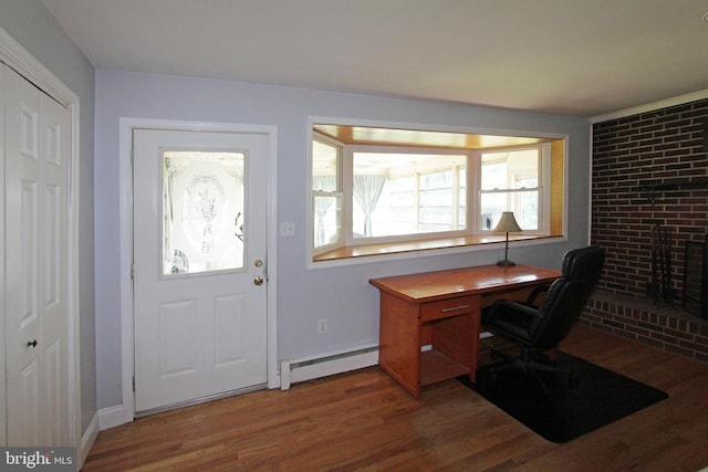 311 Norman Dr, Newark, DE 19702 - home office featuring a baseboard radiator and wood finished floors