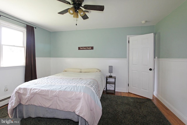 311 Norman Dr, Newark, DE 19702 - bedroom with wood finished floors, wainscoting, and ceiling fan