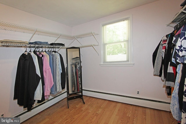 311 Norman Dr, Newark, DE 19702 - spacious closet with baseboard heating, a baseboard heating unit, and wood finished floors