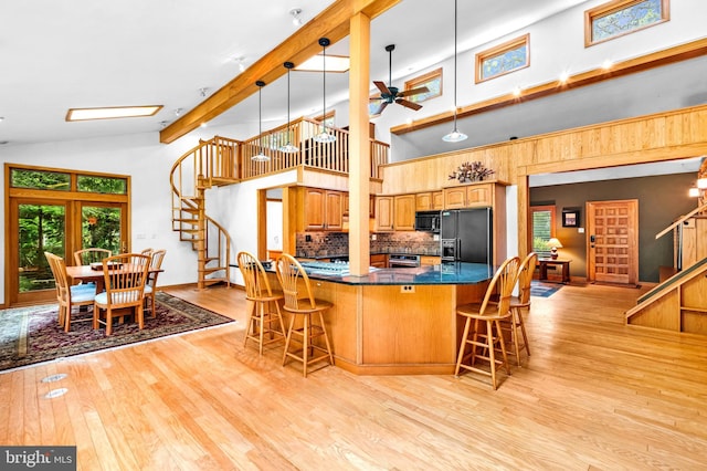 46 Grassy Lake Rd, Shamong, NJ 08088 - kitchen featuring black appliances, a kitchen breakfast bar, high vaulted ceiling, light wood-type flooring, and ceiling fan