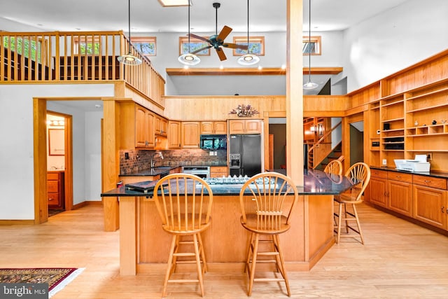 46 Grassy Lake Rd, Shamong, NJ 08088 - kitchen featuring black appliances, a high ceiling, a ceiling fan, dark countertops, and light wood finished floors