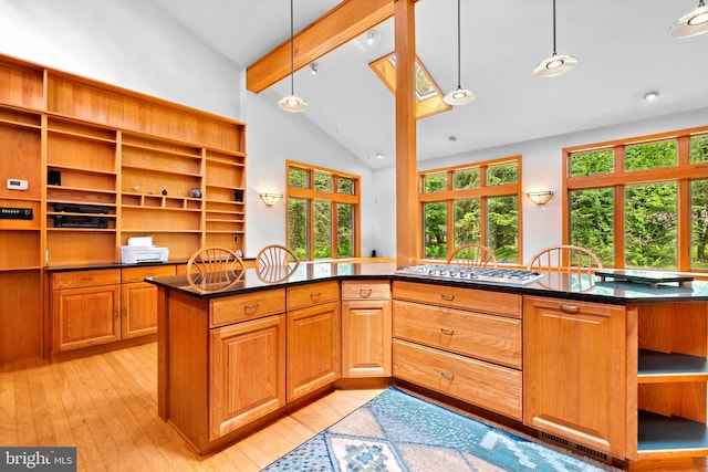 46 Grassy Lake Rd, Shamong, NJ 08088 - kitchen with open shelves, stainless steel gas stovetop, plenty of natural light, light wood-style flooring, and beam ceiling