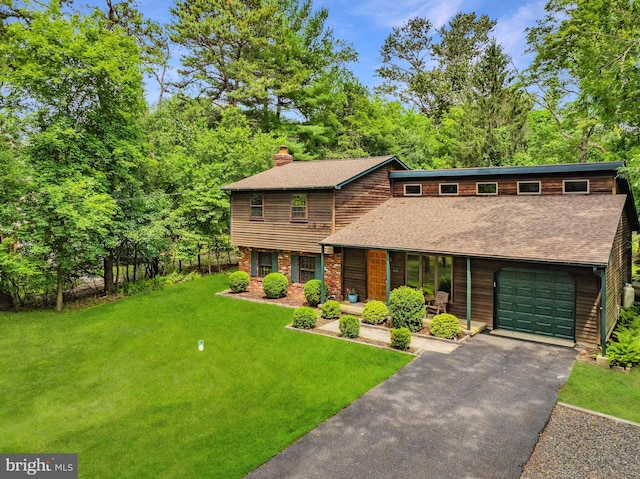 46 Grassy Lake Rd, Shamong, NJ 08088 - view of front facade featuring a chimney, a front yard, a shingled roof, asphalt driveway, and an attached garage