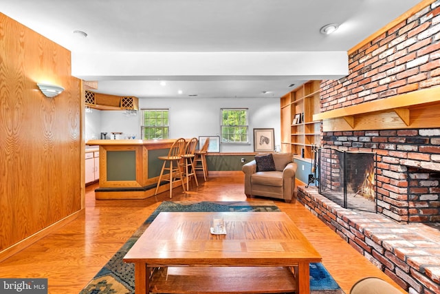 46 Grassy Lake Rd, Shamong, NJ 08088 - living area featuring wood finished floors, a brick fireplace, and bar area