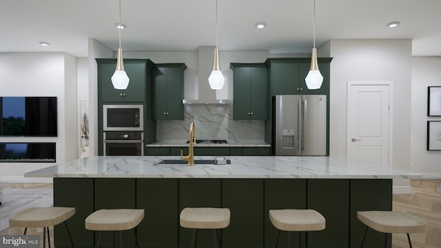 42125 Picasso Sq, Ashburn, VA 20148 - kitchen featuring stainless steel appliances, wall chimney exhaust hood, backsplash, green cabinetry, and a kitchen bar