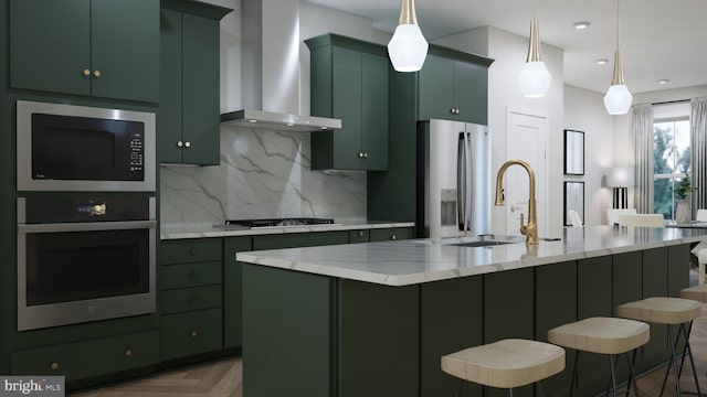 42125 Picasso Sq, Ashburn, VA 20148 - kitchen featuring appliances with stainless steel finishes, wall chimney range hood, green cabinets, and recessed lighting