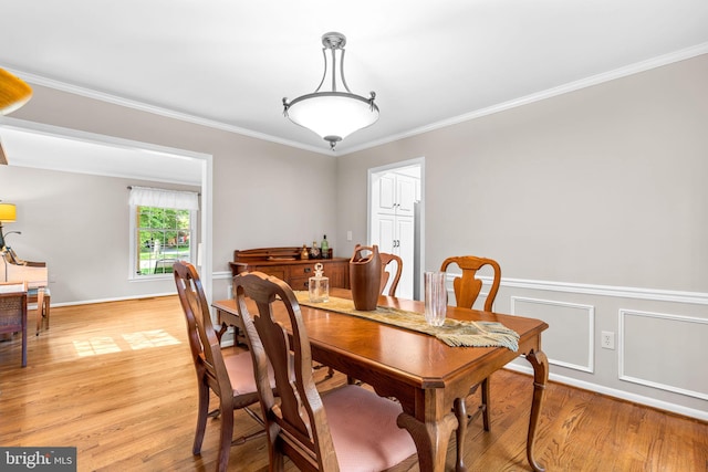 3773 Plum Hill Ct, Ellicott City, MD 21042 - dining area with light wood finished floors and ornamental molding