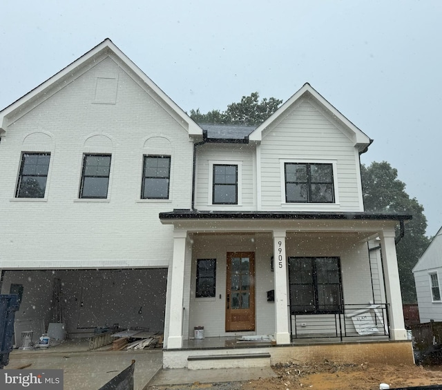 9905 Montauk Ave, Bethesda, MD 20817 - view of front of home with brick siding and a porch