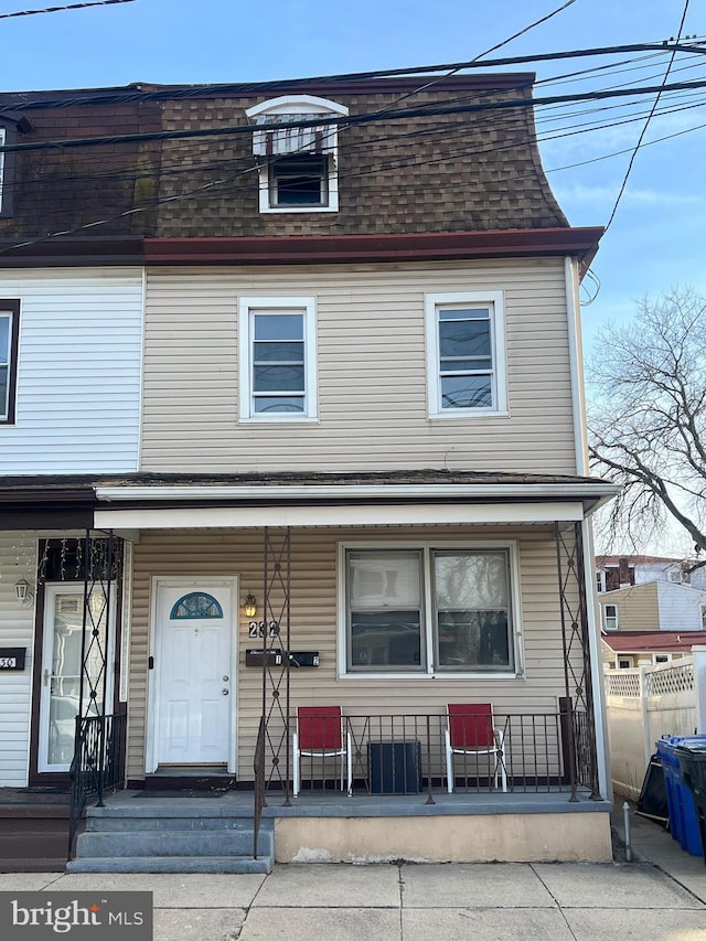 232 W Union St, Burlington, NJ 08016 - view of property with covered porch, a shingled roof, and mansard roof