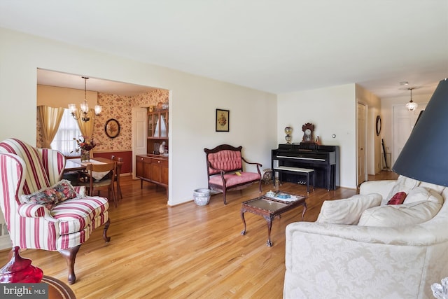1606 Peacock Ln, Silver Spring, MD 20904 - living area with a chandelier, wood finished floors, and wallpapered walls