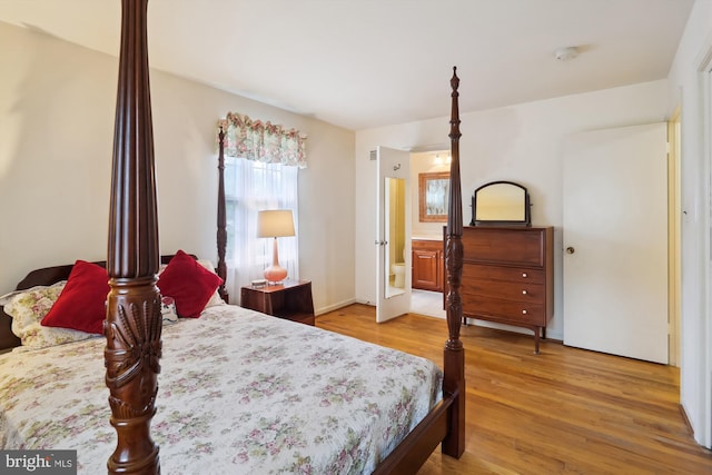 1606 Peacock Ln, Silver Spring, MD 20904 - bedroom featuring light wood finished floors and ensuite bath