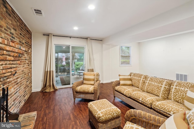 1606 Peacock Ln, Silver Spring, MD 20904 - living room featuring brick wall, wood finished floors, and recessed lighting