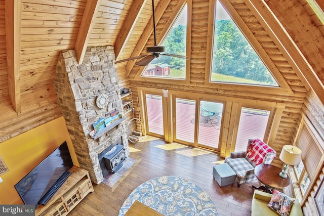 1903 Buck Mountain Rd, Bentonville, VA 22610 - living room with a wood ceiling with exposed beams, hardwood / wood-style floors, log walls, ceiling fan, and high vaulted ceiling