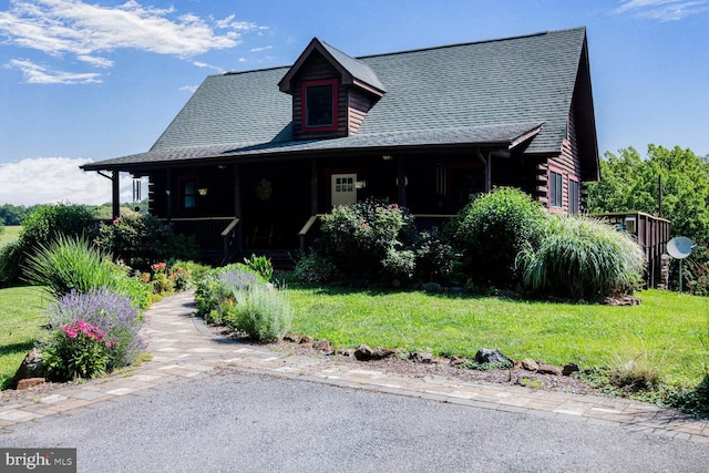 1903 Buck Mountain Rd, Bentonville, VA 22610 - cabin with covered porch, a front yard, and log siding