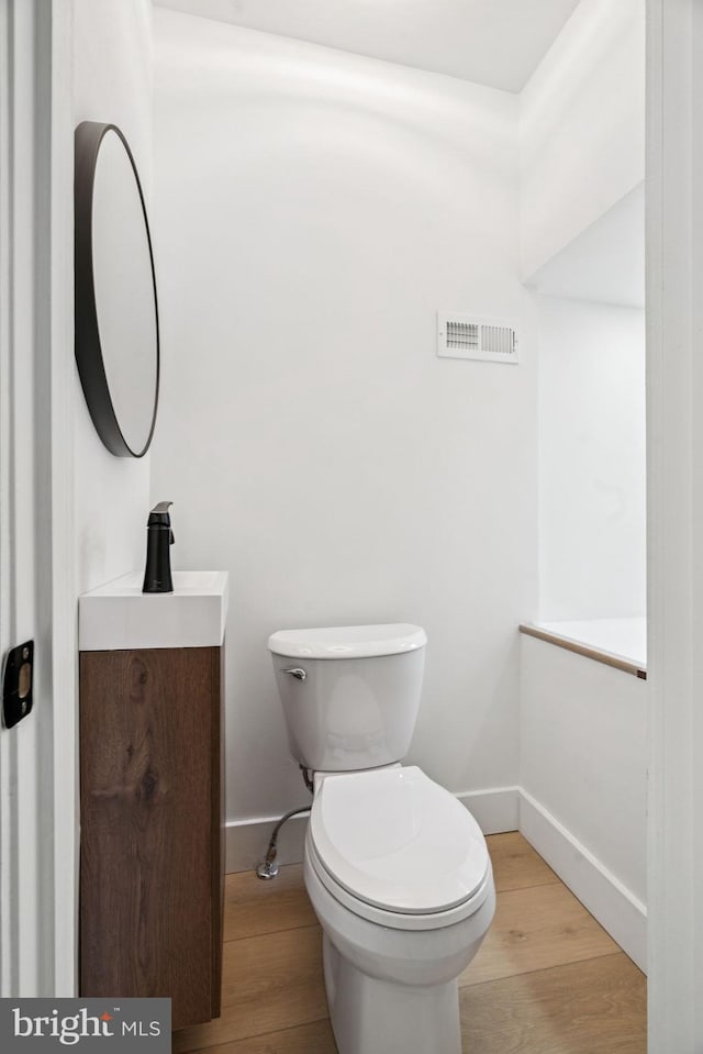 1835 Dudley St, Philadelphia, PA 19145 - half bath featuring vanity and wood finished floors