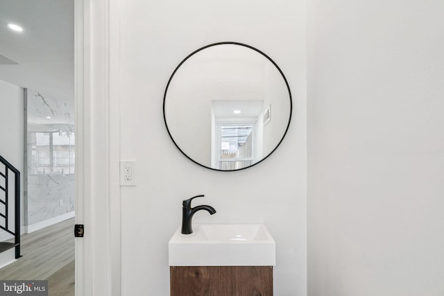 1835 Dudley St, Philadelphia, PA 19145 - bathroom with vanity, plenty of natural light, wood finished floors, and recessed lighting