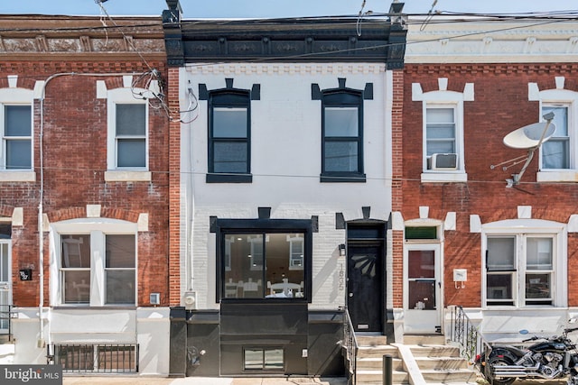 1835 Dudley St, Philadelphia, PA 19145 - view of property with brick siding, entry steps, and cooling unit