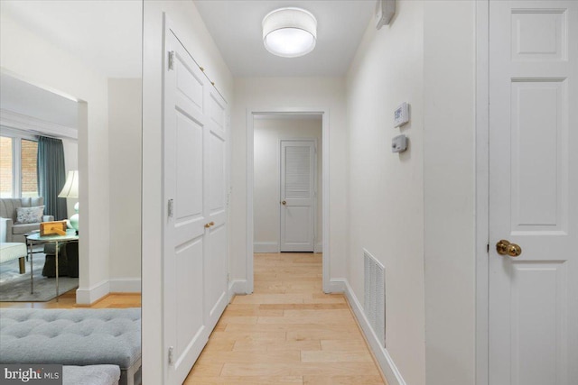 8101 Connecticut Ave Unit N-102, Chevy Chase, MD 20815 - hall featuring light wood-type flooring and baseboards