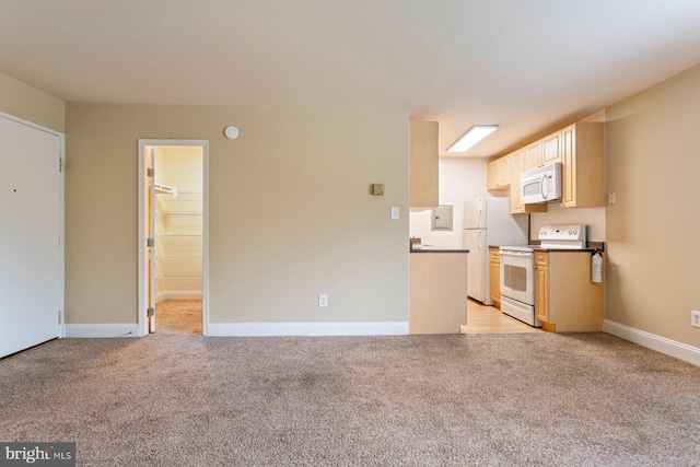 1009 Chillum Rd Unit 305, Hyattsville, MD 20782 - kitchen featuring white appliances, light carpet, dark countertops, and light brown cabinetry