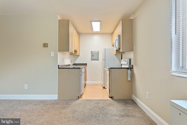 1009 Chillum Rd Unit 305, Hyattsville, MD 20782 - kitchen with electric stove, stainless steel microwave, electric panel, light carpet, and dark countertops