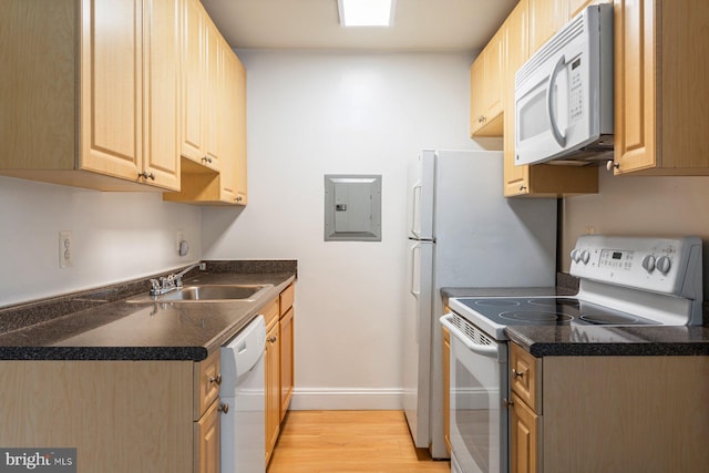 1009 Chillum Rd Unit 305, Hyattsville, MD 20782 - kitchen featuring white appliances, electric panel, light wood-type flooring, dark countertops, and light brown cabinetry