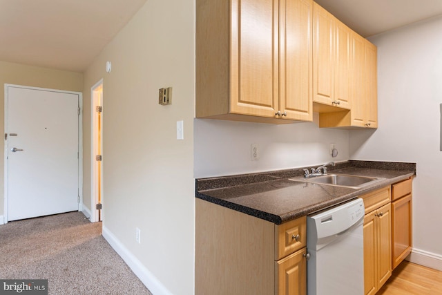 1009 Chillum Rd Unit 305, Hyattsville, MD 20782 - kitchen with white dishwasher, dark countertops, and light brown cabinetry