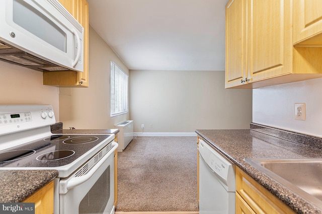 1009 Chillum Rd Unit 305, Hyattsville, MD 20782 - kitchen with white appliances, carpet flooring, dark countertops, and light brown cabinetry
