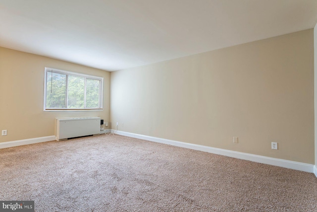 1009 Chillum Rd Unit 305, Hyattsville, MD 20782 - spare room featuring light carpet and radiator heating unit