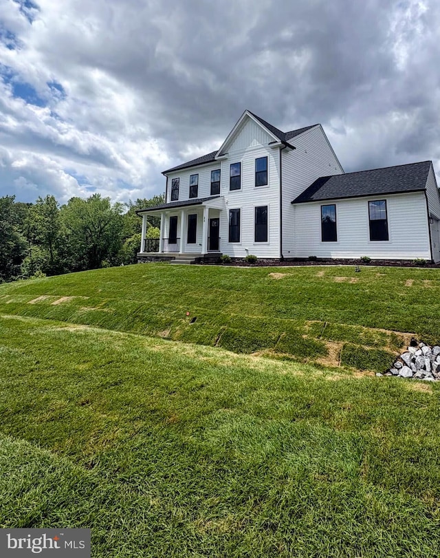 22 Clydesdale Rd, Fredericksburg, VA 22405 - view of front facade featuring covered porch, a front yard, and board and batten siding