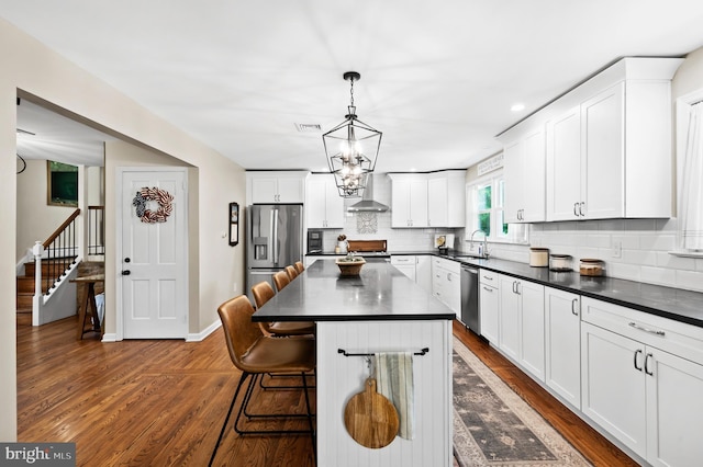126 Woodview Dr, Doylestown, PA 18901 - kitchen featuring appliances with stainless steel finishes, dark countertops, dark wood-style floors, tasteful backsplash, and recessed lighting