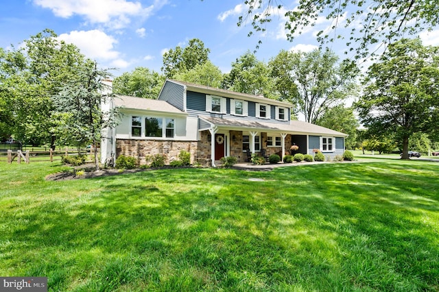 126 Woodview Dr, Doylestown, PA 18901 - view of front facade with stone siding, a chimney, and covered porch