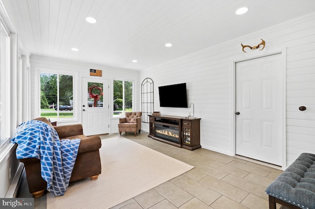 126 Woodview Dr, Doylestown, PA 18901 - living room with recessed lighting, light tile patterned floors, and wooden walls