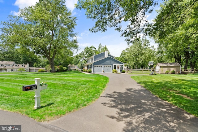126 Woodview Dr, Doylestown, PA 18901 - view of community with driveway, a yard, an attached garage, and an outdoor structure