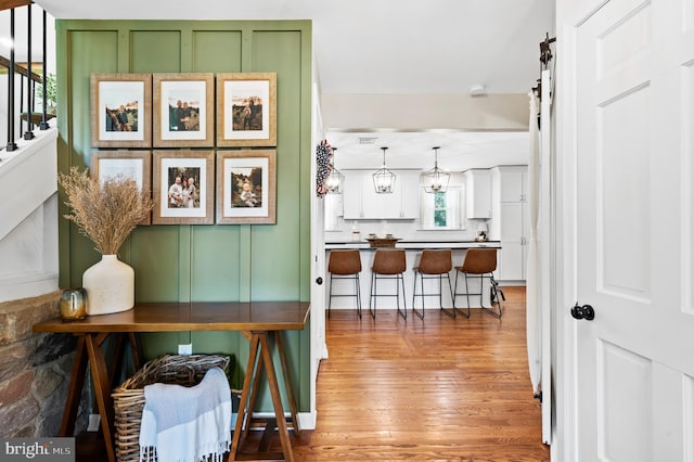 126 Woodview Dr, Doylestown, PA 18901 - hallway featuring light wood-style flooring and a barn door