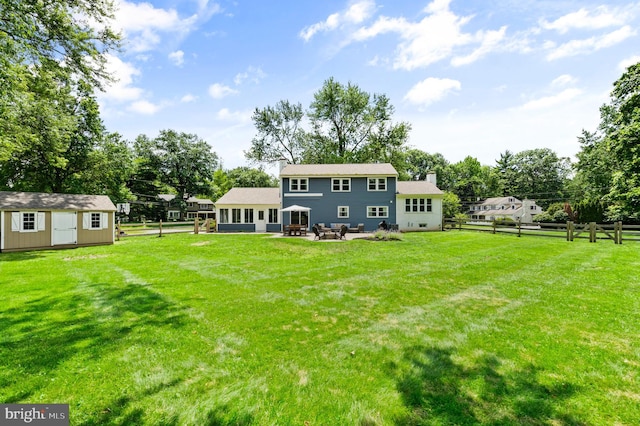 126 Woodview Dr, Doylestown, PA 18901 - rear view of property with a patio area, a chimney, a shed, and view of wooded area