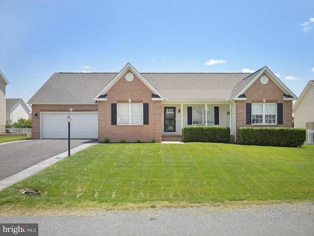 101 Carrera Ct, Inwood, WV 25428 - single story home with driveway, brick siding, a front yard, and a garage