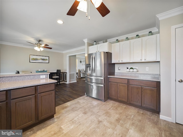 101 Carrera Ct, Inwood, WV 25428 - kitchen featuring stainless steel fridge, ceiling fan, ornamental molding, light countertops, and white cabinets
