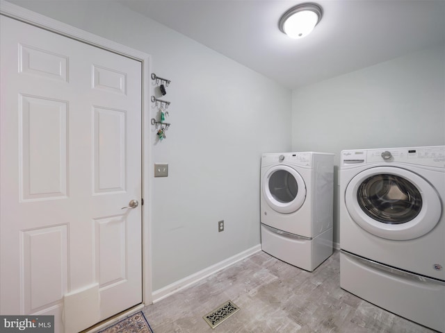 101 Carrera Ct, Inwood, WV 25428 - washroom featuring washing machine and dryer and light wood-style flooring
