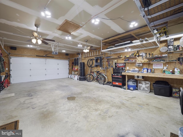 101 Carrera Ct, Inwood, WV 25428 - garage featuring a workshop area, a garage door opener, and a ceiling fan