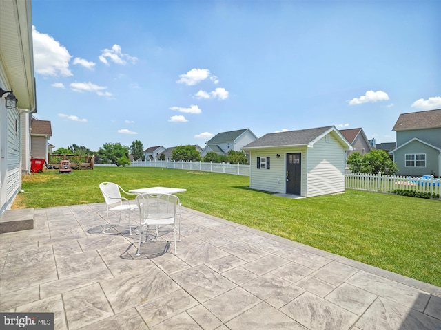 101 Carrera Ct, Inwood, WV 25428 - fenced backyard with a patio, an outbuilding, outdoor dining space, and a residential view